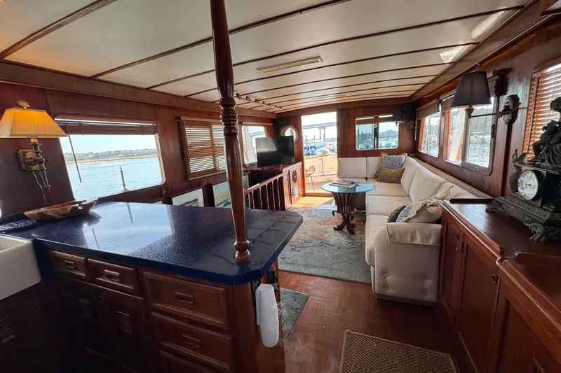 Slide: The Image of Luxurious interior of 1979 Cheoy Lee 46 LRC yacht with elegant wood finishes. - 38