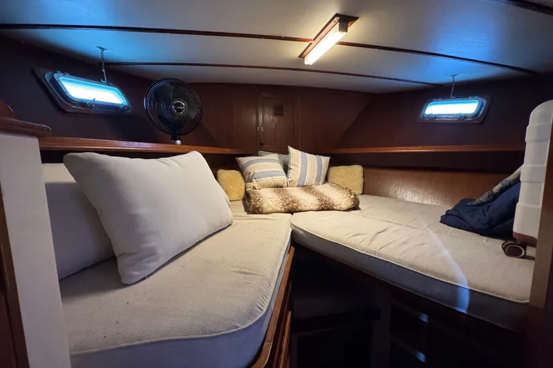 Slide: The Image of Cozy cabin interior of 1979 Cheoy Lee 46 LRC yacht with cushions and portholes. - 43