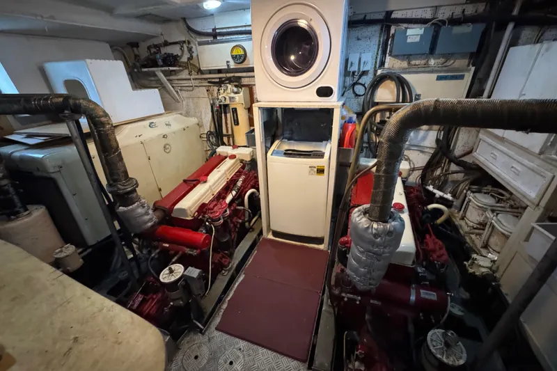 Slide: The Image of Engine room of 1979 Cheoy Lee 46 LRC with washer and mechanical equipment. - 52