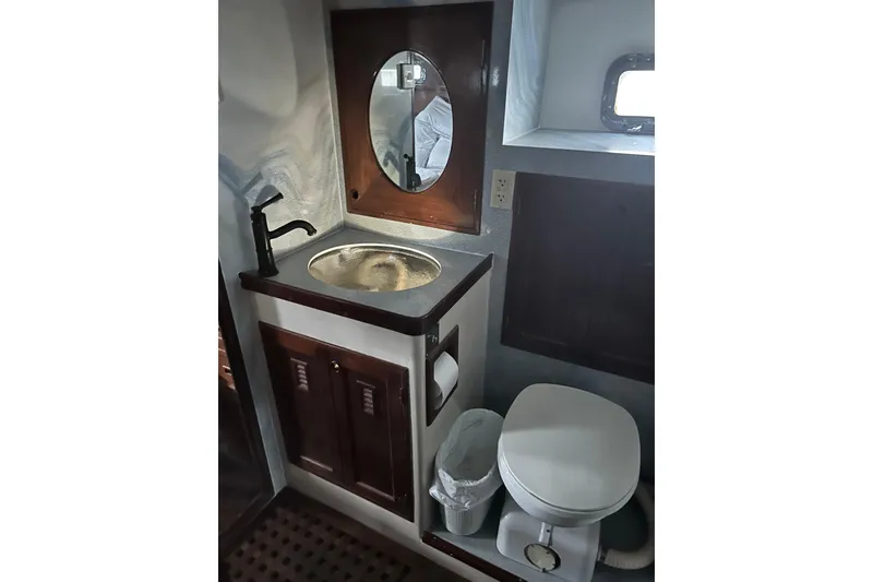Slide: The Image of Interior of 1979 Cheoy Lee 46 LRC yacht with cozy seating and kitchen area. - 9