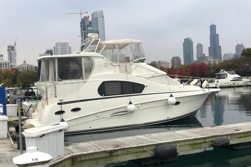 Slide: The Image of 2006 Silverton 35 Motor Yacht interior with helm, seating, and navigation equipment. - 16