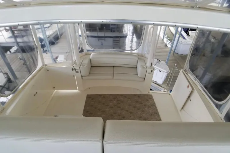 Slide: The Image of Interior of 2006 Silverton 35 Motor Yacht with wooden paneling and porthole window. - 24
