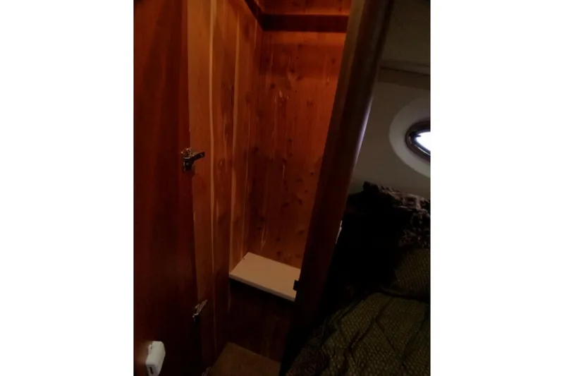 Slide: The Image of 2006 Silverton 35 Motor Yacht docked at marina, monochrome view. - 27