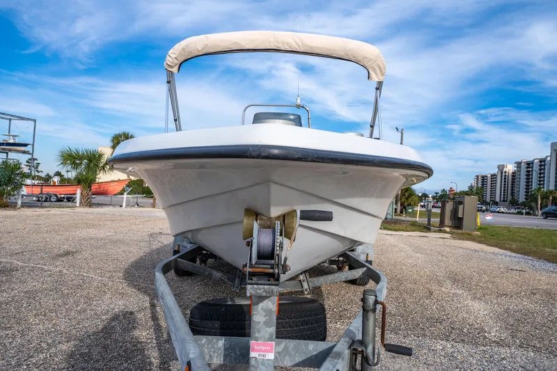 Slide: The Image of 2002 ProMaster 190 BAY boat on trailer under blue sky, ready for adventure. - 10
