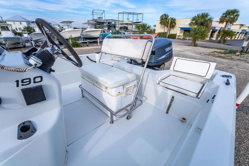 Slide: The Image of 2002 ProMaster 190 BAY boat interior with Yamaha engine, featuring steering console and seating. - 15