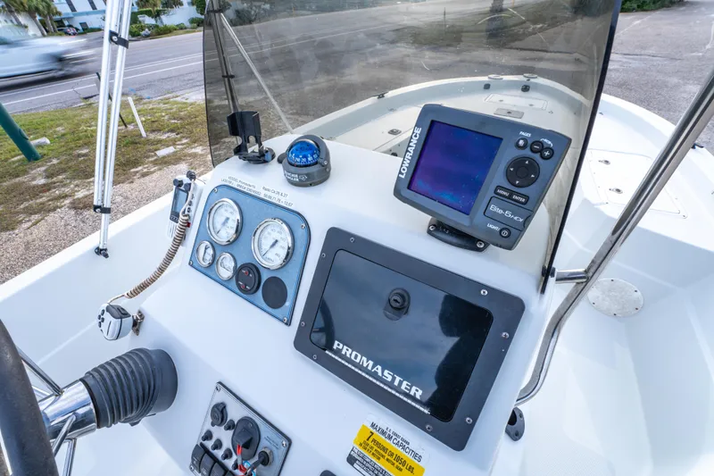 Slide: The Image of Steering console of 2002 ProMaster 190 BAY boat with gauges and navigation equipment. - 22