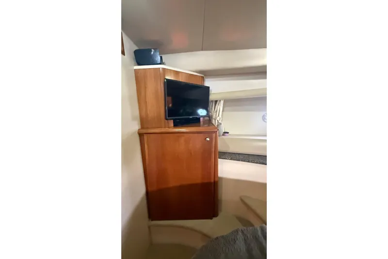 Slide: The Image of Interior of 2004 Meridian 459 Motoryacht with TV and wooden cabinet. - 12