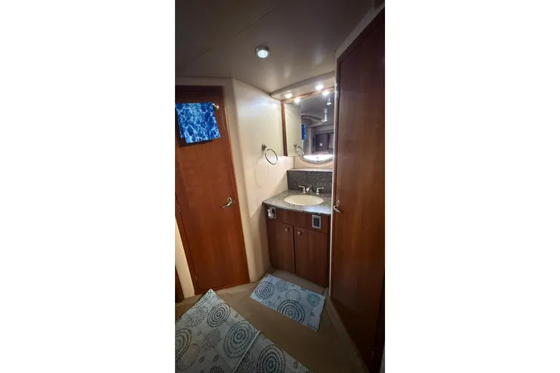 Slide: The Image of Bathroom interior of 2004 Meridian 459 Motoryacht with wooden cabinetry and sink. - 17