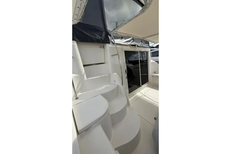 Slide: The Image of 2004 Meridian 459 Motoryacht interior with curved stairs and sliding glass door. - 4