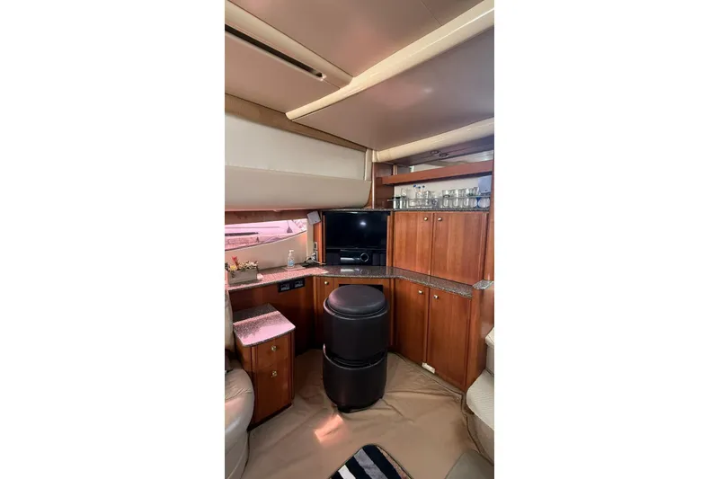 Slide: The Image of Interior of 2004 Meridian 459 Motoryacht with wood cabinetry and entertainment center. - 9