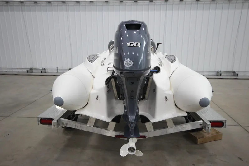 Slide: The Image of Zodiac Yachtline 440 DL NEO 60hp on trailer, rear view. - 4