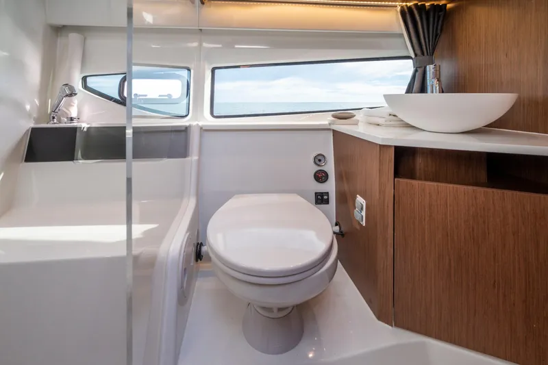 Slide: The Image of Modern bathroom in 2026 Beneteau Antares 11 Coupe yacht with sleek design and ocean view. - 17