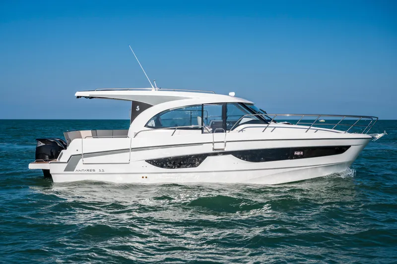 Slide: The Image of 2026 Beneteau Antares 11 Coupe cruising on open sea under clear blue sky. - 4