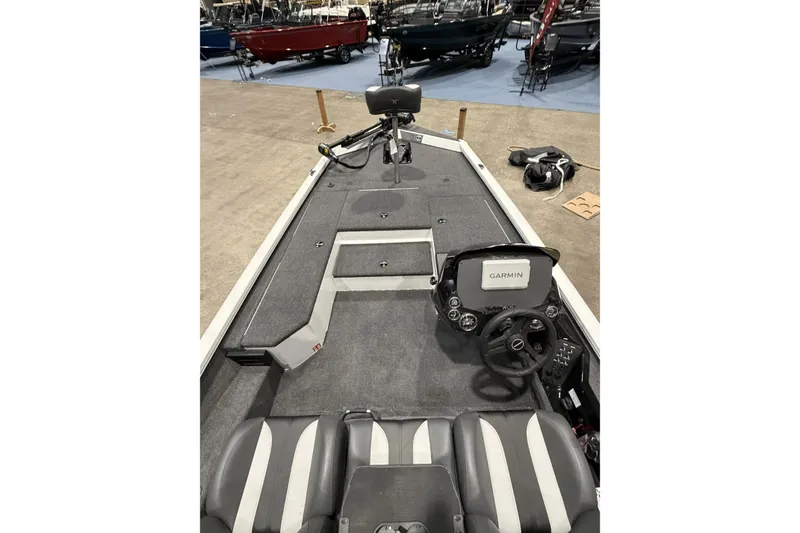 Slide: The Image of 2026 Vexus Defender 189 boat interior with Garmin navigation system and seating. - 10