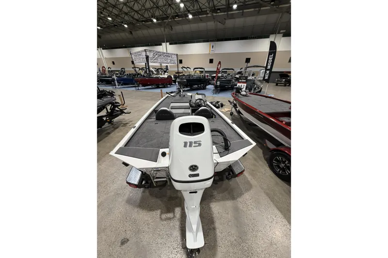 Slide: The Image of 2026 Vexus Defender 189 boat displayed at an indoor exhibition, showcasing its sleek design. - 4