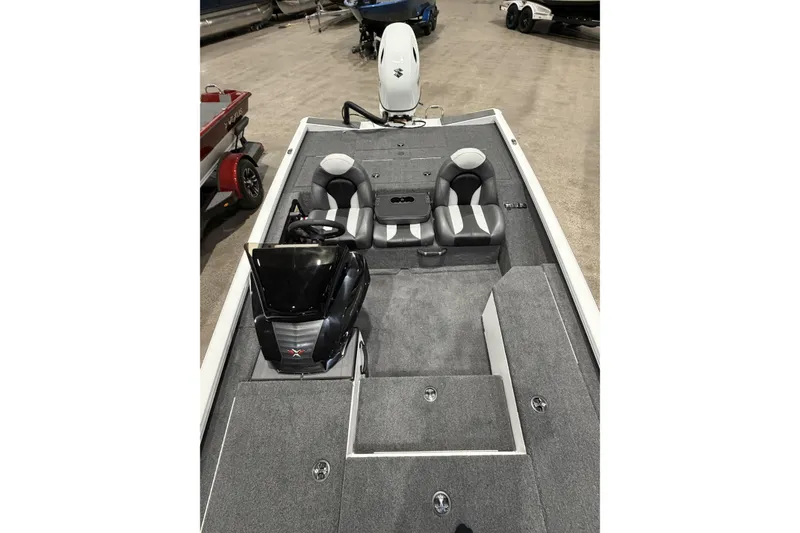 Slide: The Image of 2026 Vexus Defender 189 boat interior with dual seats and steering console. - 7