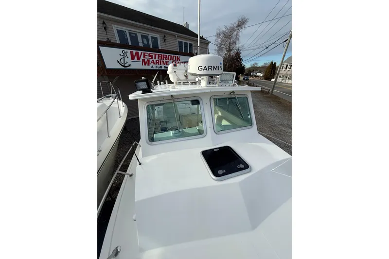 Slide: The Image of 2007 Steiger Craft 26 Miami boat at Westbrook Marine Center, featuring Garmin equipment. - 11