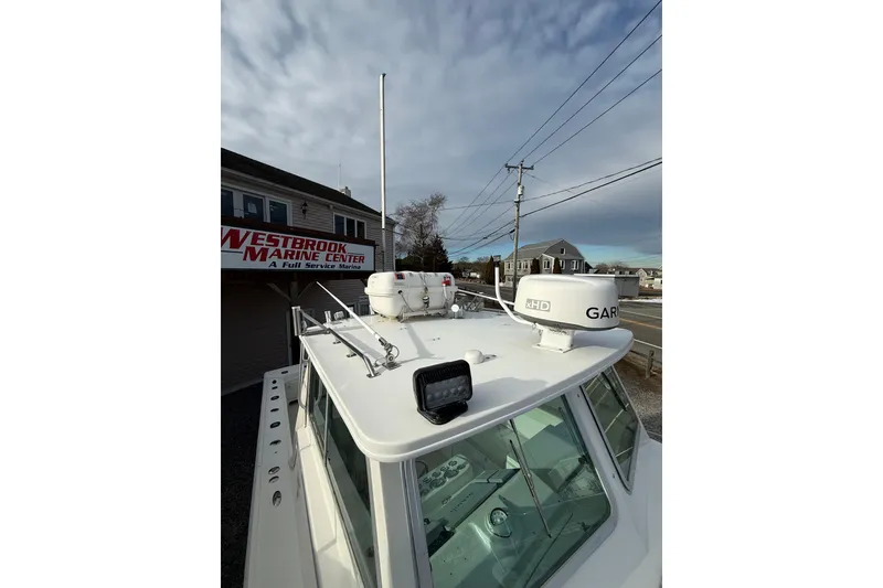 Slide: The Image of 2007 Steiger Craft 26 Miami boat at Westbrook Marine Center, featuring radar and navigation equipment. - 12