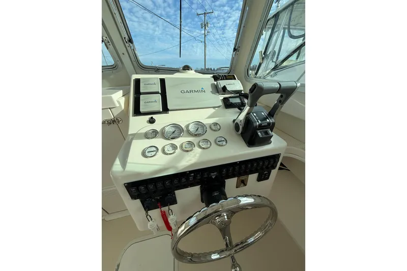 Slide: The Image of Control panel of 2007 Steiger Craft 26 Miami boat with Garmin navigation system. - 17