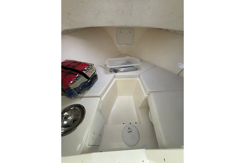 Slide: The Image of 2007 Steiger Craft 26 Miami cabin interior with seating and storage. - 19