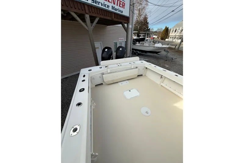 Slide: The Image of 2007 Steiger Craft 26 Miami boat deck at marina, showcasing spacious layout. - 6