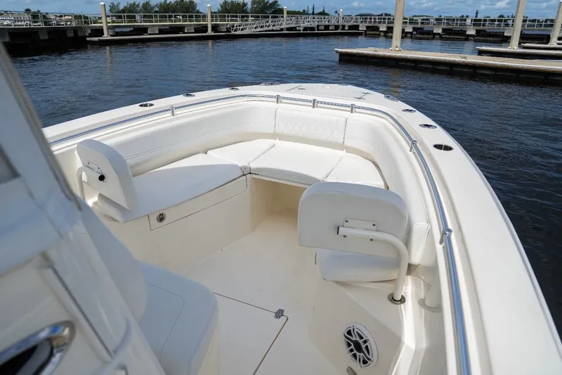 Slide: The Image of 2020 Cobia 262 Center Console boat with spacious seating at the dock. - 12