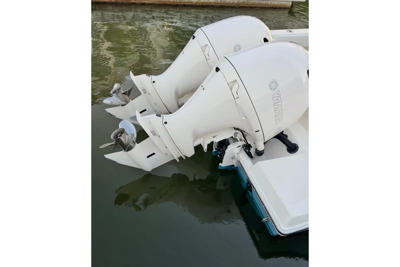 Slide: The Image of Twin Yamaha outboard engines on a 2020 Cobia 262 Center Console boat. - 15