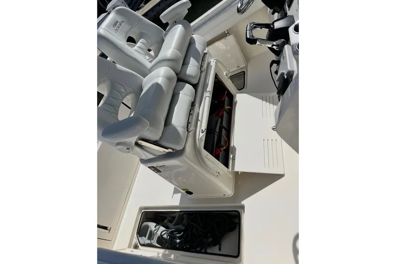 Slide: The Image of 2020 Cobia 262 Center Console boat interior with open storage compartments. - 17