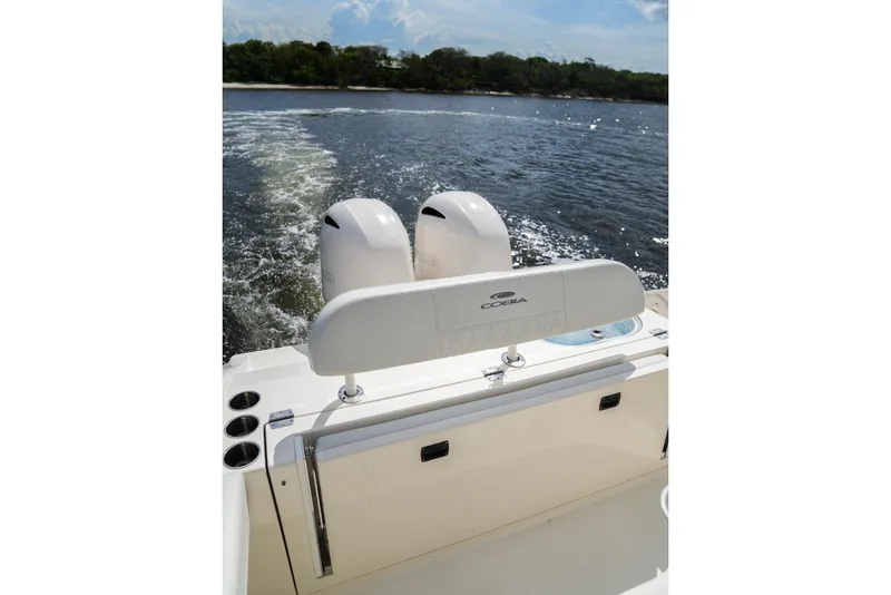 Slide: The Image of 2020 Cobia 262 Center Console boat with dual engines on open water. - 8