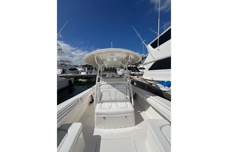 Slide: The Image of 2016 Regulator 34 Center Console boat docked under clear blue sky. - 10