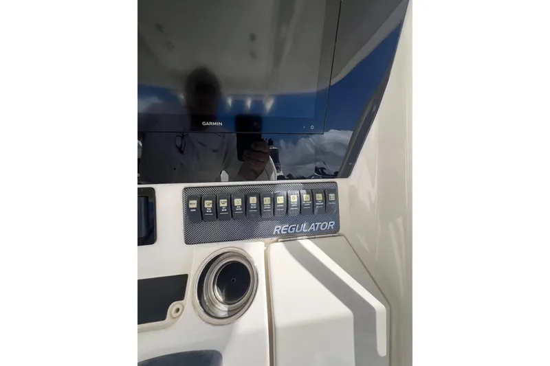 Slide: The Image of 2016 Regulator 34 Center Console dashboard with Garmin display and control panel. - 20