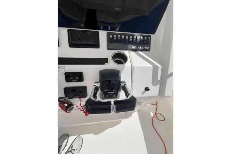 Slide: The Image of 2016 Regulator 34 Center Console dashboard with Yamaha controls and electronic panel. - 21