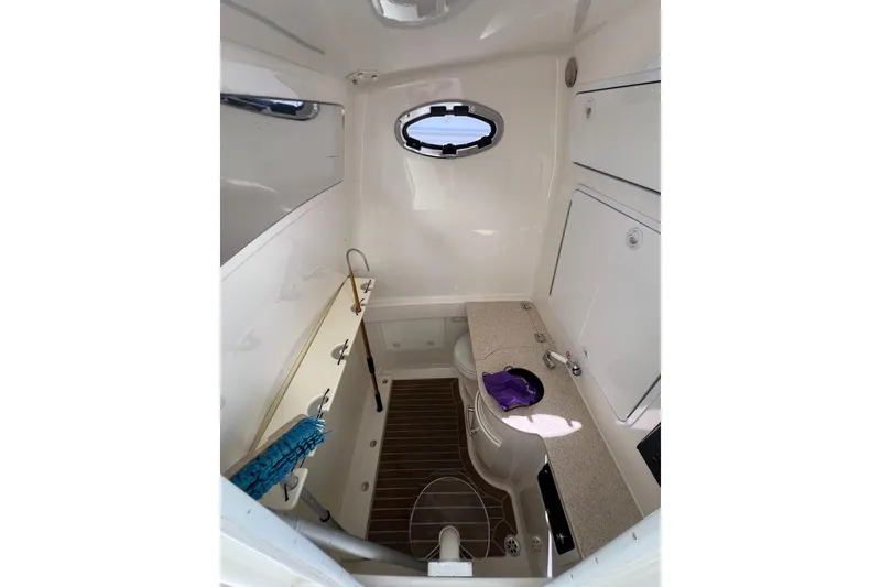 Slide: The Image of 2016 Regulator 34 Center Console cabin interior with sink and storage. - 25
