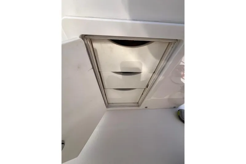 Slide: The Image of Storage compartment on a 2016 Regulator 34 Center Console boat. - 28