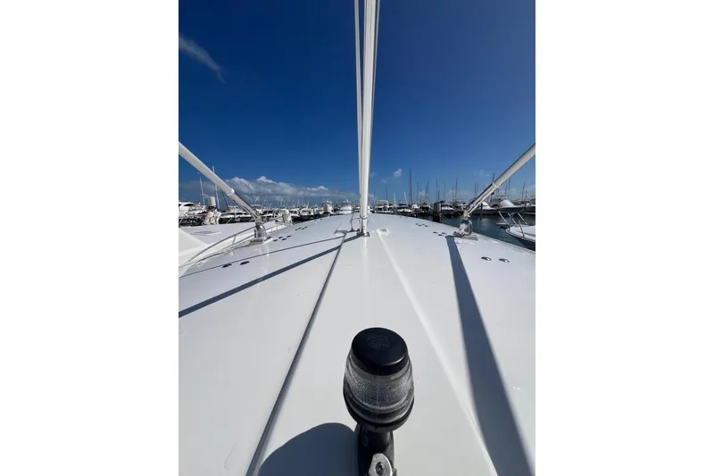 Slide: The Image of 2016 Regulator 34 Center Console boat docked under clear blue sky. - 4