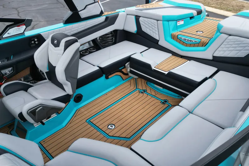 Slide: The Image of 2022 Nautique Super Air Nautique G21 interior with luxurious seating and modern design. - 13