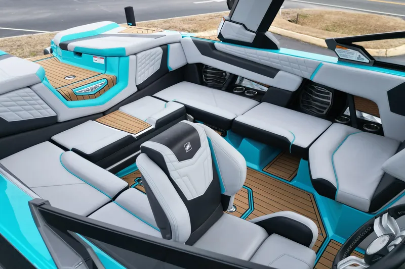 Slide: The Image of 2022 Nautique Super Air Nautique G21 interior with luxurious seating and modern design. - 14