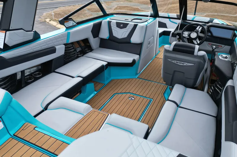 Slide: The Image of 2022 Nautique Super Air Nautique G21 interior with luxurious seating and modern design. - 15