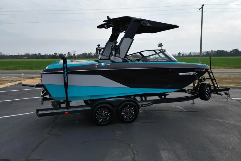 Slide: The Image of 2022 Nautique Super Air Nautique G21 boat on trailer, parked outdoors. - 4