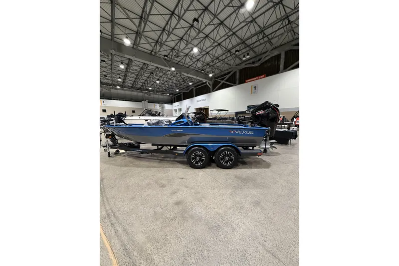 Slide: The Image of 2026 Vexus AVX 1985s boat in an exhibition hall. - 13