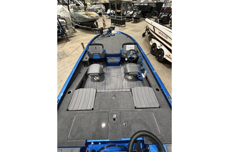 Slide: The Image of 2026 Vexus AVX 1985s boat interior with seating and control panel, displayed indoors. - 5