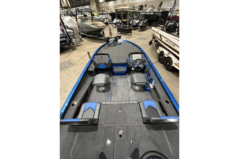 Slide: The Image of 2026 Vexus AVX 1985s boat interior at a showroom, featuring modern seating and controls. - 6