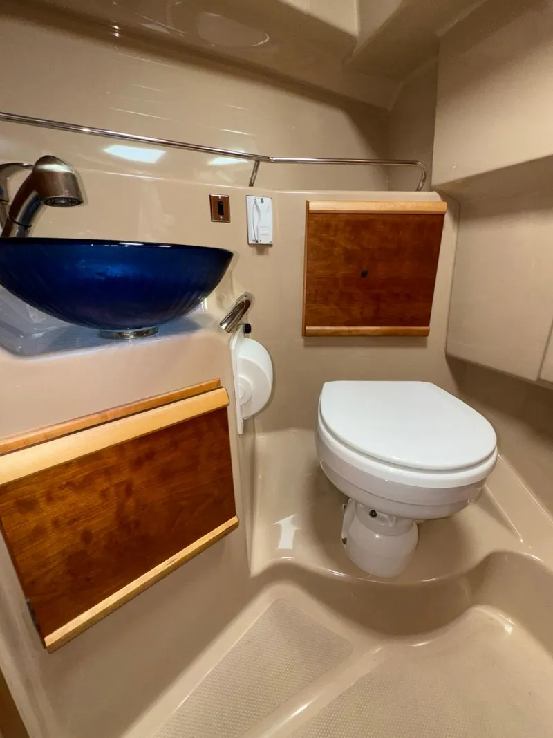 Slide: The Image of 2015 Cutwater C-26 boat bathroom with modern sink and toilet. - 24