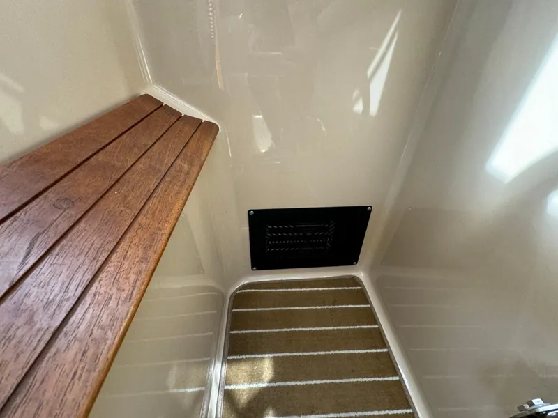 Slide: The Image of Interior of 2015 Cutwater C-26 boat with wooden bench and vent. - 30