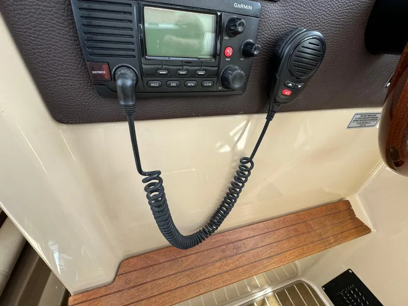 Slide: The Image of 2015 Cutwater C-26 boat radio system with microphone and control panel. - 33