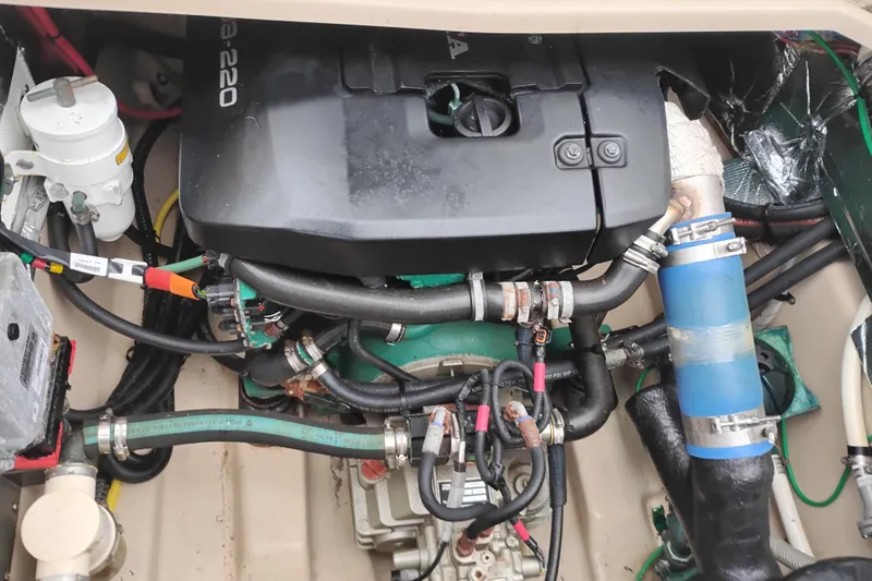 Slide: The Image of Engine compartment of a 2015 Cutwater C-26 boat, showcasing detailed components and wiring. - 42