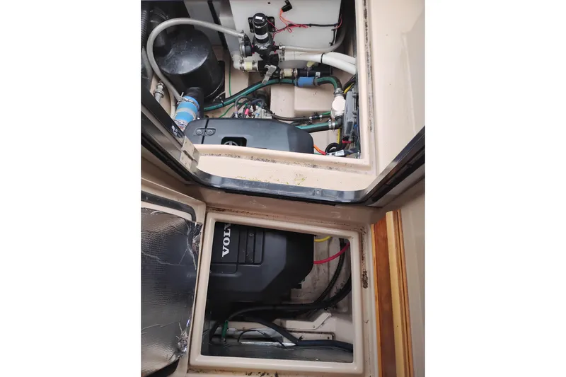 Slide: The Image of Engine compartment of a 2015 Cutwater C-26 boat, featuring Volvo components. - 45