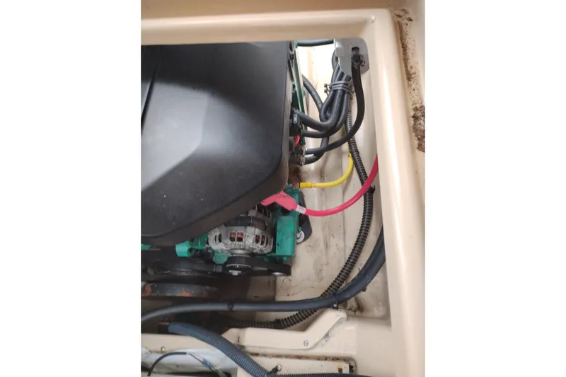 Slide: The Image of Engine compartment of a 2015 Cutwater C-26 boat, showing wiring and components. - 46