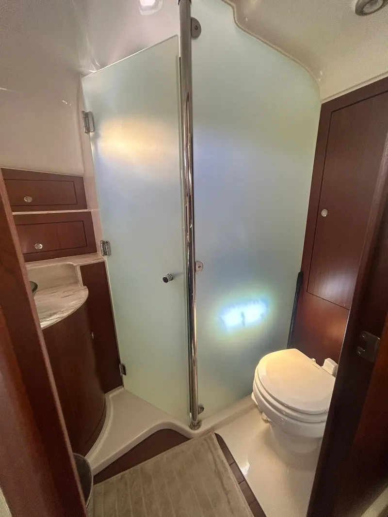Slide: The Image of Bathroom interior of 2019 Pursuit OS 385 Offshore boat with shower and toilet. - 30