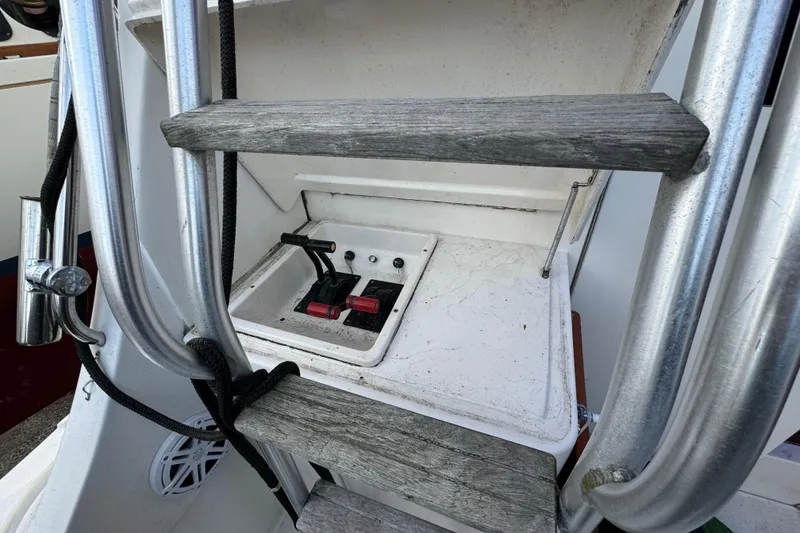 Slide: The Image of Control panel and ladder on a 1990 Luhrs 320 Tournament boat. - 7